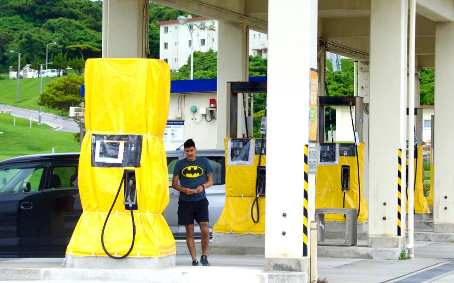Exchange gas pumps are covered in waterproofing at Camp Foster, Okinawa, Monday, July 31, 2023, in preparation for Typhoon Khanun.