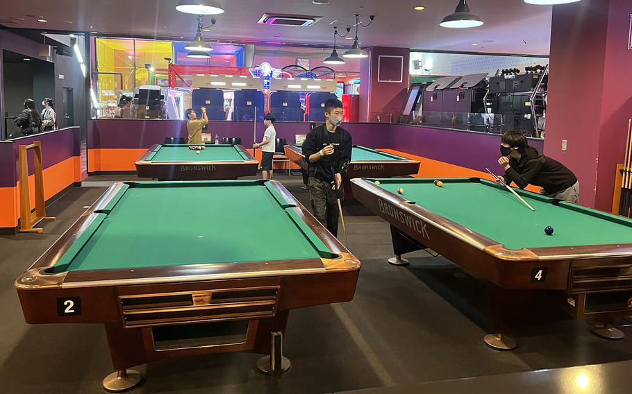 Round1 patrons play pool at the location in Musashimurayama, Japan, Jan. 8, 2023. 