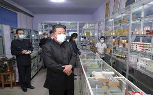 In this photo provided by the North Korean government, North Korean leader Kim Jong Un, center, visits a pharmacy in Pyongyang, North Korea on May 15, 2022. 