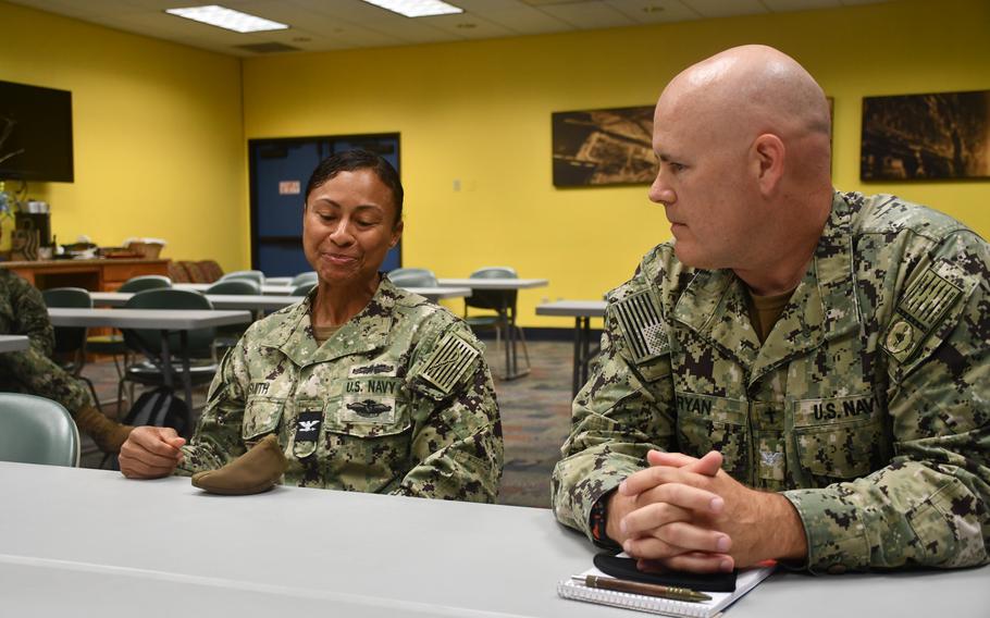 Capt. Richard Ryan, right, discusses chaplains’ roles in the religious exemption process for the coronavirus vaccine at Naval Base San Diego on Aug. 17, 2021. Ryan oversees chaplains in the Navy’s Pacific surface forces.