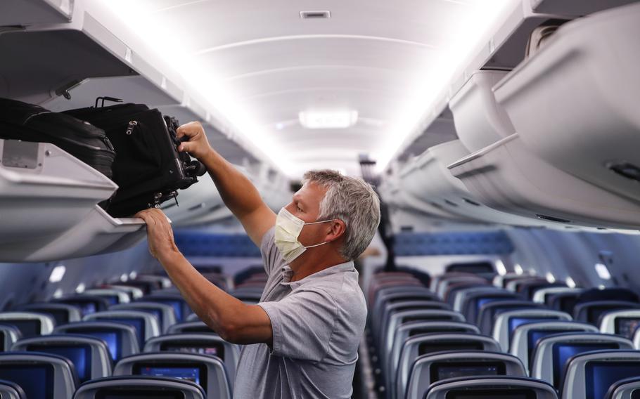 A passenger wears personal protective equipment on a Delta Airlines flight after landing in Minneapolis on May 28, 2020