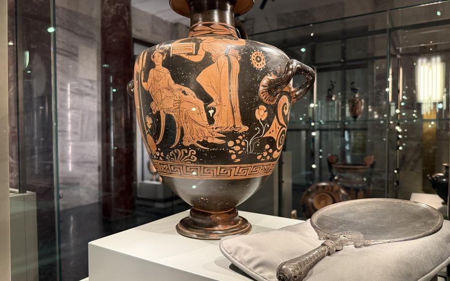 A Greek vase is displayed at a museum.