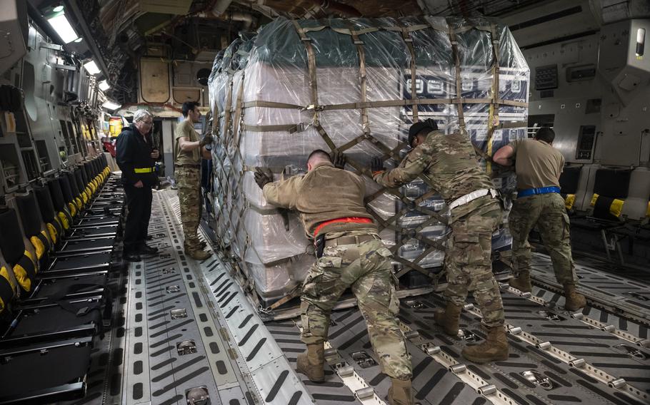 Airmen from the 436th Aerial Port Squadron load a pallet of cargo onto a C-17 Globemaster III on Dover Air Force Base, Del., Feb. 7, 2023.