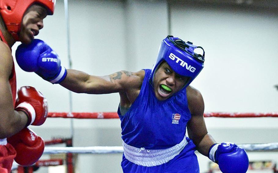 Staff Sgt. Naomi Graham throws a right to the chin of Briana Che during a USA nationals bout at Salt Lake City, Utah, in December 2019.