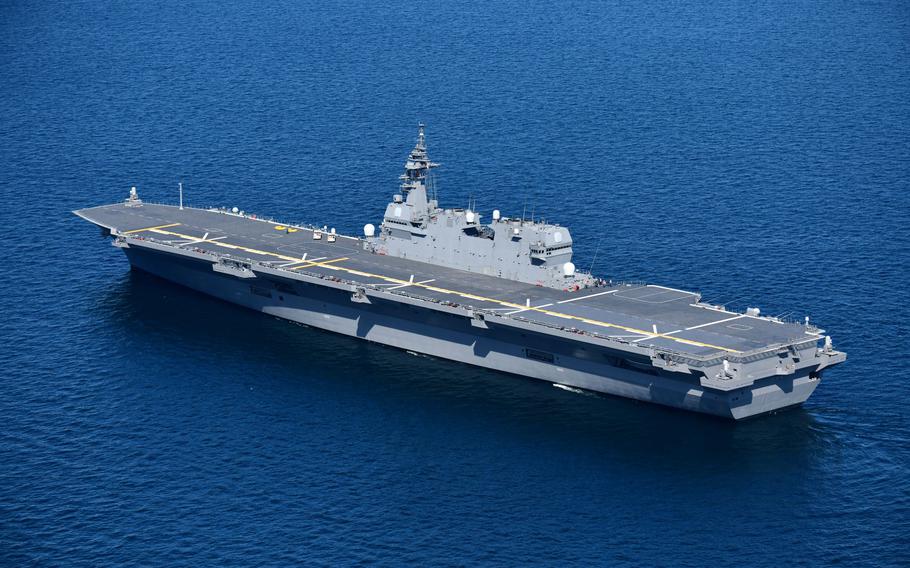 The JS Izumo, a Japanese helicopter carrier, conducts training with Marine Corps F-35B Lightning II stealth jets in the Philippine Sea, Sunday, Oct. 3, 2021. 