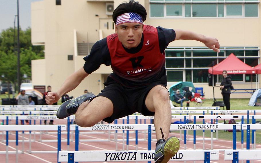 Vicente Gomez competes in the hurdles.