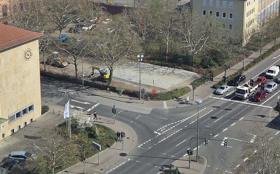 An early April view from city hall onto the parking lot where the foundation for the skate park has already been laid. The city announced it is due to open on Wednesday.