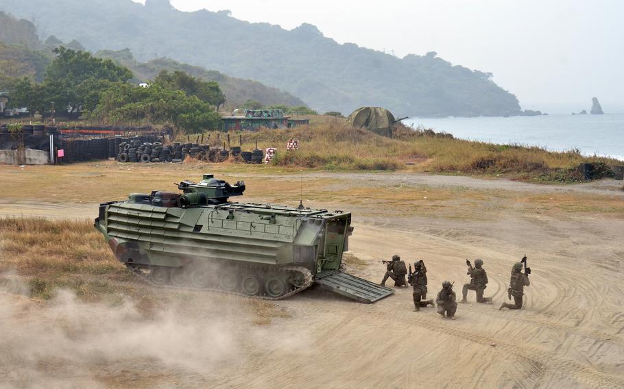 Taiwanese marines exit an armored vehicle during training near Kaohsiung, Taiwan, Jan. 12, 2023.