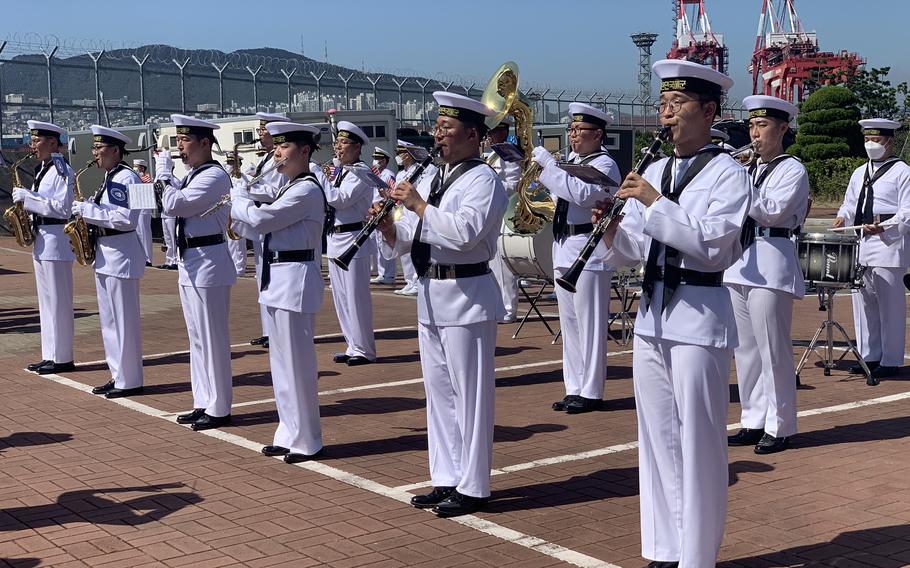 South Korean navy sailors welcome the USS Ronald Reagan and its strike group to Busan, South Korea, Friday, Sept. 23, 2022. 