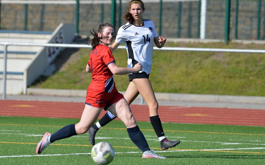 Stuttgart’s Kendall Boudreaux watches her cross head towards the box past Lakenheath’s Emily Blanke, where teammate Ella Engelke converted it for the lone goal in the girls Division I final at the DODEA-Europe soccer championships in Ramstein, Germany, May 18, 2023. 