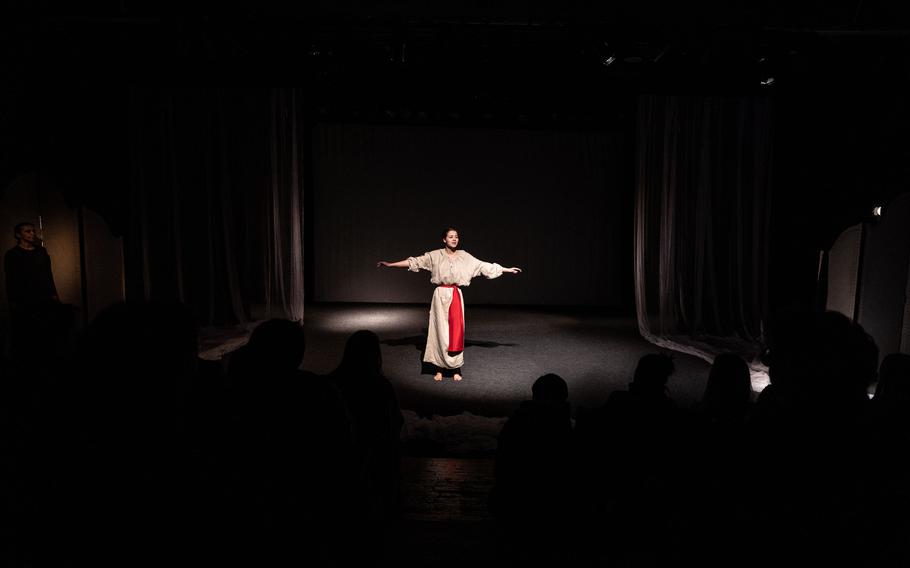 An actress holds forth on the stage of the Lesya Ukrainka National Academic Theater in Kyiv during its first performances since Russia invaded Ukraine.