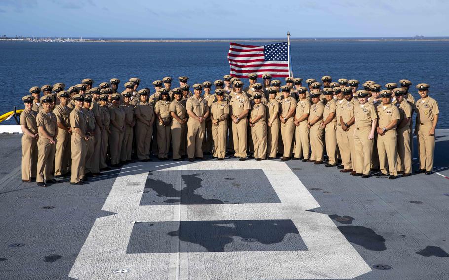 A group of Navy chiefs pose for a photo