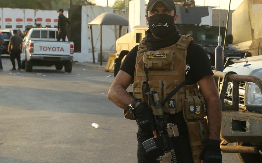 Popular Mobilization Forces surround the heavily fortified Green Zone, where the Prime Minister's offices are located in Baghdad, Iraq, Wednesday, May 26, 2021. 