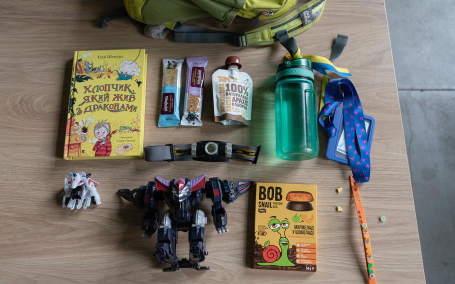 Natalia Sulima has prepared a survival backpack for her son, with snacks, toys, and his favorite book. 