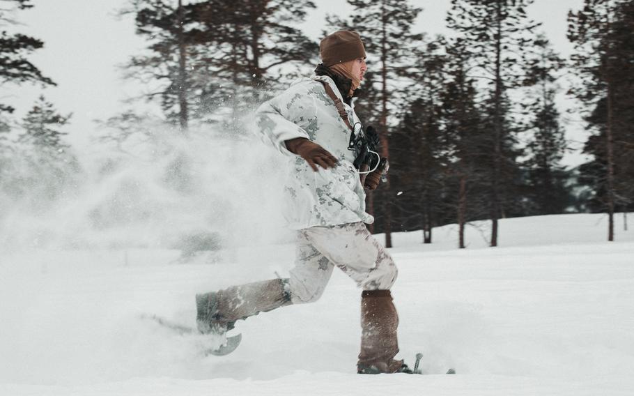 Marine Corps Staff Sgt. John Graham, a native of Corpus Christi, Texas, and a platoon sergeant with 2d Low Altitude Air Defense Battalion, Marine Air Control Group 28, 2d Marine Aircraft Wing, II Marine Expeditionary Force, runs in snowshoes prior to Exercise Cold Response 2022 in Norway on Feb. 18, 2022. Cold Response is a biennial exercise with militaries from NATO nations and regional partners. 