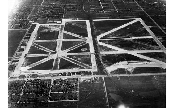 An aerial view of the Chicago Municipal Airport, now called Midway, shows how the airport was bisected by railroad tracks until 1940.