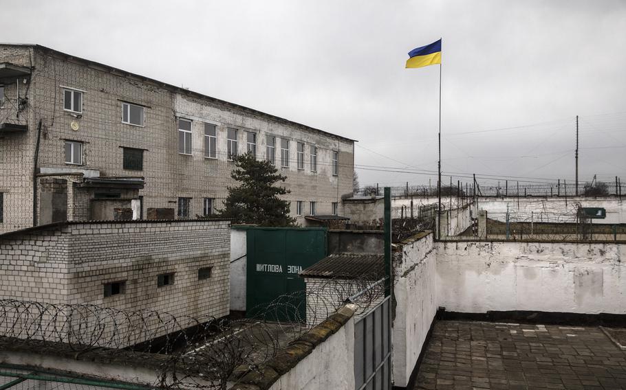 The Ukrainian national flag is seen at a detention camp where Russian prisoners of war are being held in captivity in western Ukraine on Jan. 17.