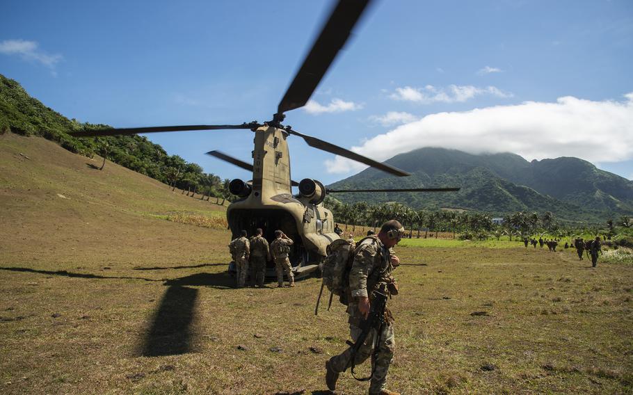 Soldiers with the 25th Infantry Division exit a CH-47F Chinook during air-assault exercise on Batan Island, Philippines, May 5, 2024.
