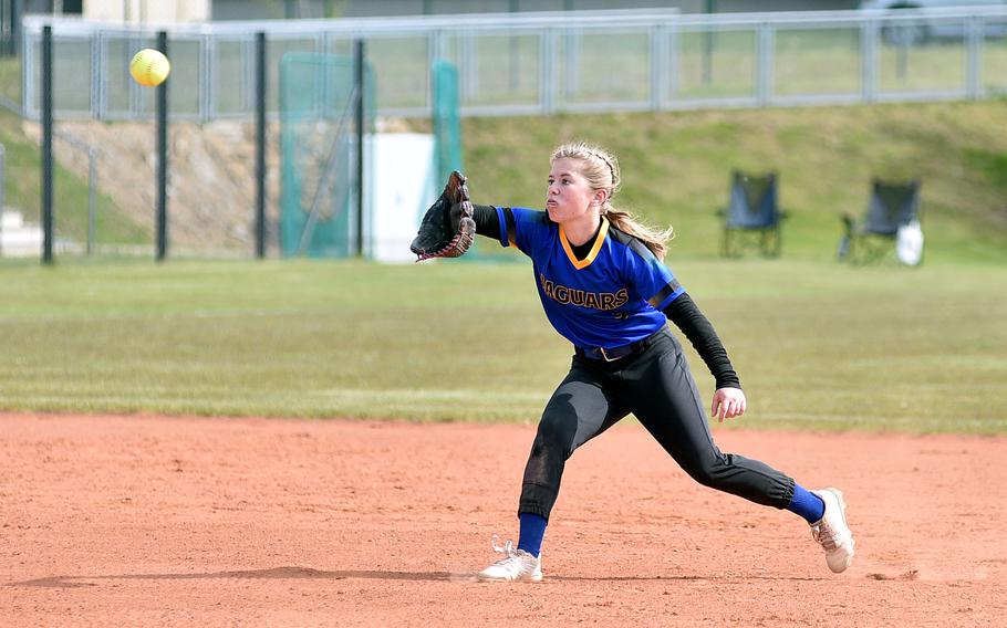 Sigonella shortstop Aelah Wilson runs in front of second baseman to retrieve a throw from home plate during an April 27, 2024, game against Spangdahlem at Spangdahlem High School in Spangdahlem, Germany.