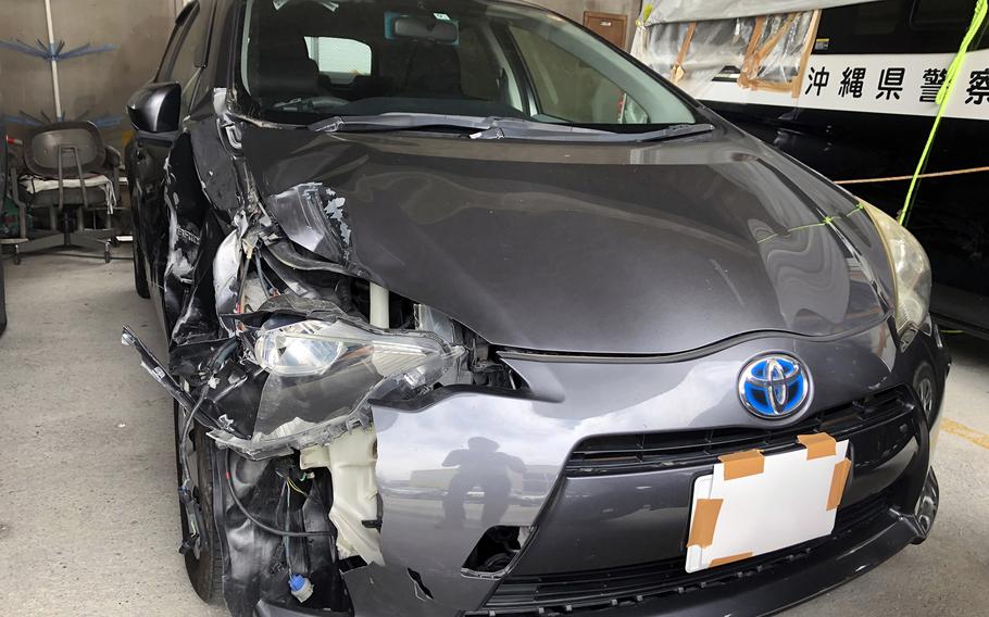 A Toyota Aqua sits damaged at the police station in Nago, Okinawa, Wednesday, May 31, 2023.