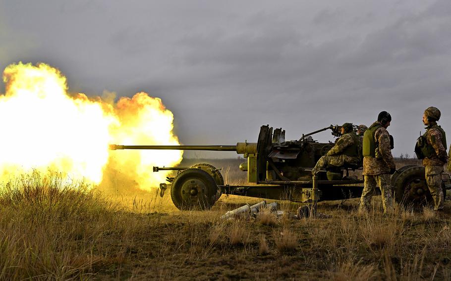 Ukrainian servicemen fire artillery during an anti drone drill in Chernigiv region on Nov. 11, 2023.