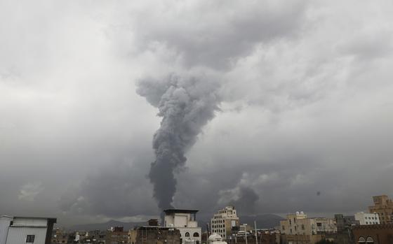 Smoke rises from various sites.