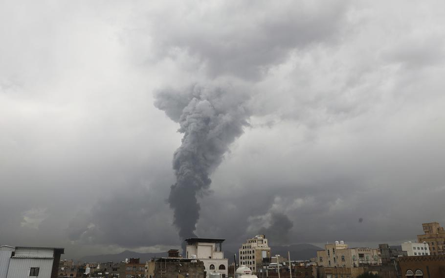 Smoke rises from various sites.
