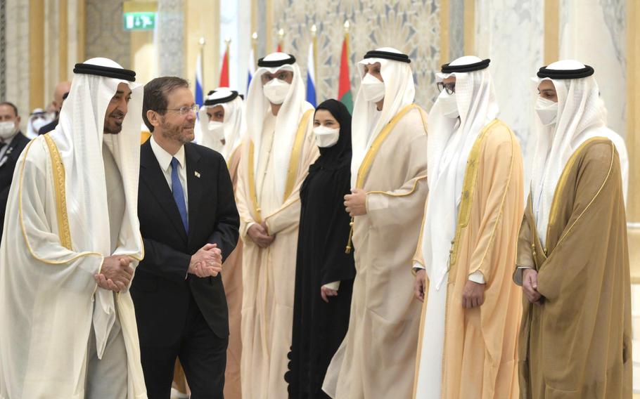 President Isaac Herzog, walks with the Crown Prince of Abu Dhabi, Sheikh Mohammed bin Zayed Al Nahyan, left, as he arrives at the royal palace, in Abu Dhabi, United Arab Emirates, Sunday, Jan. 30, 2022. Israel's president arrived in the United Arab Emirates on Sunday in the first official visit by the country's head of state, the latest sign of deepening ties between the two nations as tensions rise in the region. 