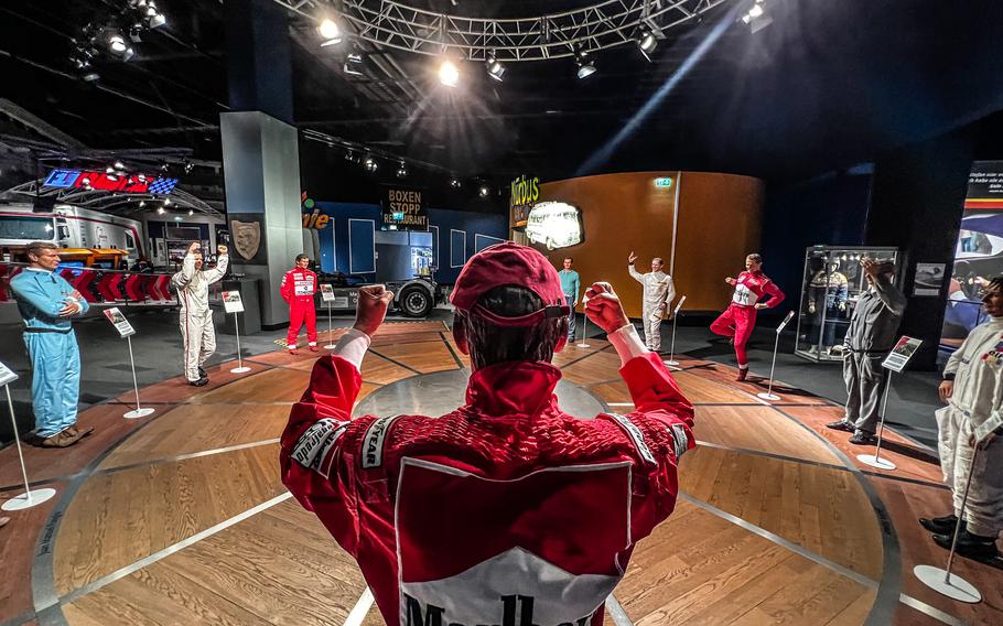 A jubilant figure of Niki Lauda cheers with other racing legends in the Ringwerk racing museum in Nuerburg, Germany, Jan. 15, 2022. Lauda nearly lost his life on the Nuerburgring race track during a fiery accident with his Formula 1 racecar in 1976. 