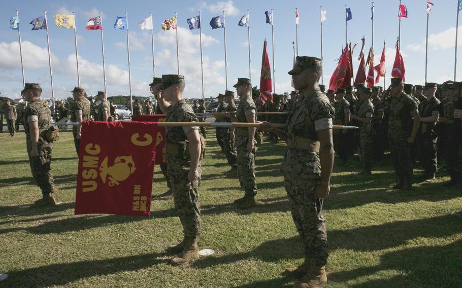 Marines render a salute as Maj. Gen. Stephen Liszewski assumes command of Marine Corps Installations Pacific from Maj. Gen. William Bowers at Camp Foster, Okinawa, Japan, on June 24, 2022. 