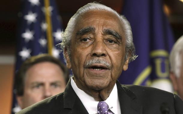 Congressman Charles Rangel, seen from the chest up, speaks while standing in front of a U.S. flag.
