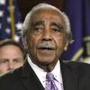 Congressman Charles Rangel, seen from the chest up, speaks while standing in front of a U.S. flag.