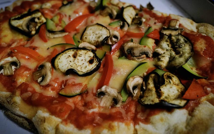 A vegetarian pinsa at Grifo Restaurant in Kerzenheim, Germany, Jan. 10, 2024. The dish features a crispy crust topped with mozzarella cheese, grilled zucchini, bell peppers and mushrooms, offering a hearty option for patrons seeking a twist on pizza.
