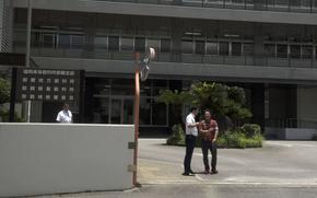 Media members stand outside Naha District Court on Okinawa following the first trial day for a U.S. Marine accused of attemped sexual assault, June 2, 2025.