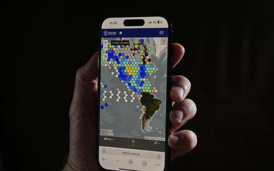 Data from the Integrated Ocean Observing System is displayed on a cell phone.