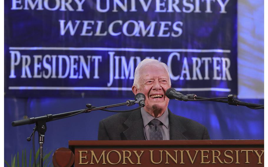 Former President Jimmy Carter takes the podium to answer questions from students during his annual town hall with Emory University freshmen in the campus gym on Sept. 12, 2018, in Atlanta.