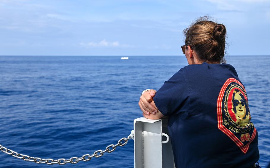 U.S. Coast Guard Cmdr. Nicole Tesoniero, U.S. Coast Guard Cutter Harriet Lane commanding officer, watches a fishery boarding take place with U.S. Coast Guard members and Fijian shipriders from the Republic Fiji Navy, Ministry of Fisheries, Fiji Immigration, and Fiji Revenue and Customs Services in the Fiji Exclusive Economic Zone in the South Pacific Ocean, Feb. 15, 2024. 