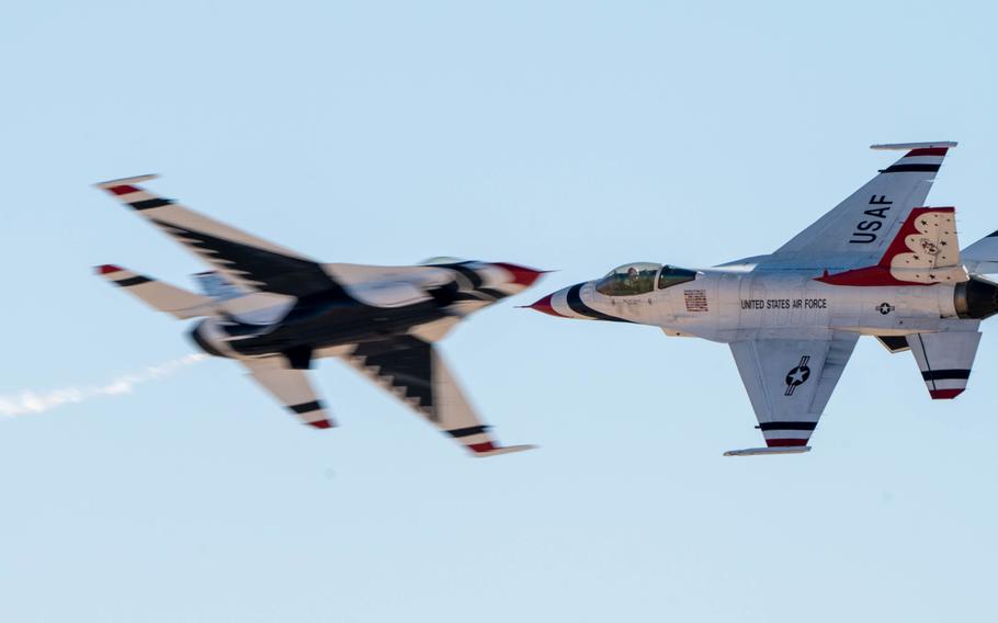 Two airplanes cross paths in the sky