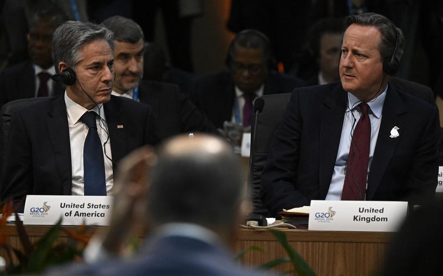 U.S. Secretary of State Antony Blinken (left), British Foreign Secretary David Cameron (right), and Russian Foreign Minister Sergei Lavrov (backwards) attend the G20 foreign ministers meeting in Rio de Janeiro, Brazil, on Feb. 21, 2024. 