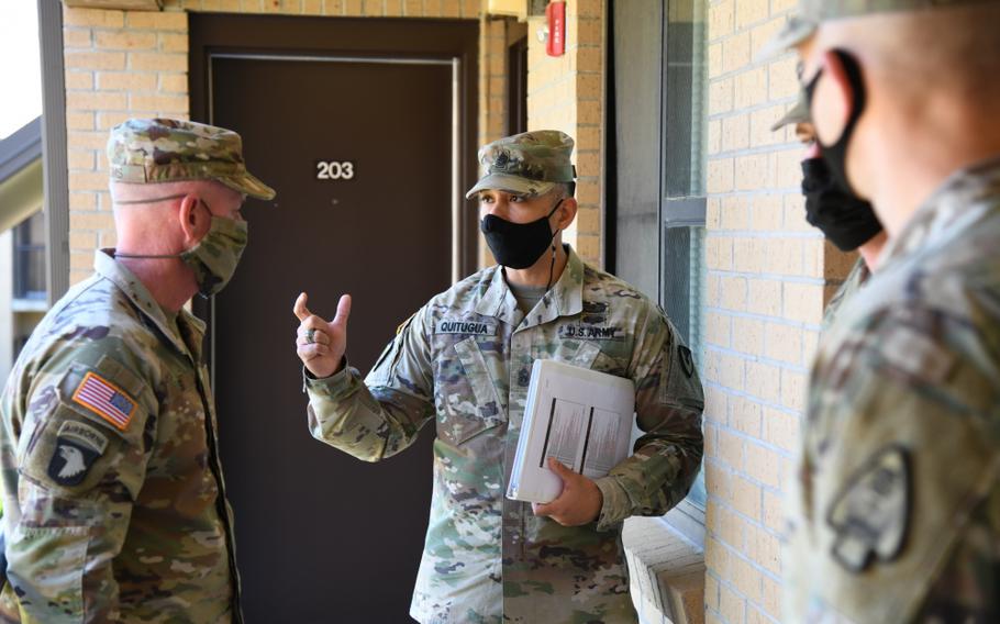 Command Sgt. Maj. Raymond Perez Quitugua Jr., Fort Rucker garrison command sergeant major, provides a tour of the barracks for Command Sgt. Maj. Todd Sims, U.S. Army Forces Command command sergeant major, during his visit to Fort Rucker , Ala., April 19, 2021.
