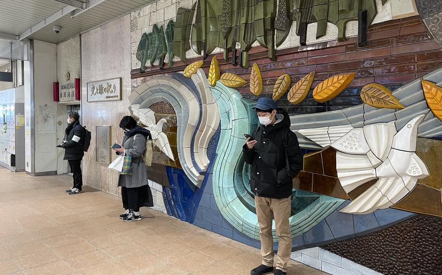 Shoji Morimoto, 38, known as Japan’s “do-nothing guy,” waits for his client at a subway station outside Tokyo.