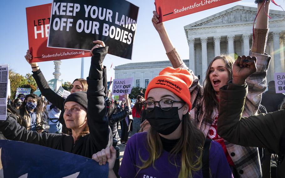 Pro-abortion and pro-life activists demonstrate in front of the Supreme Court on Nov. 1, 2021, in Washington.