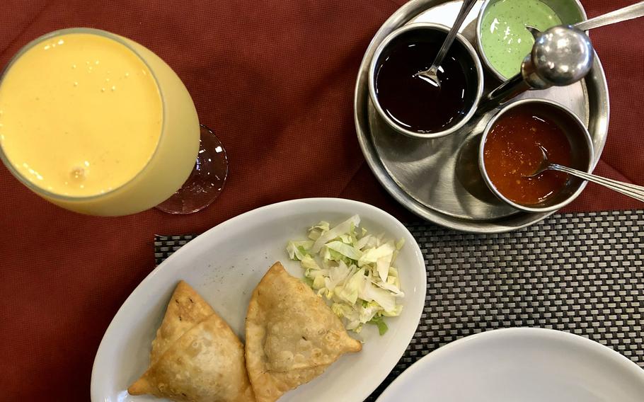Appetizers offered at Mughal-e-Azam Indian restaurant in Naples, Italy, include vegetarian and chicken samosas, which are served with tamarind, mint and spicy sauces on the side. 