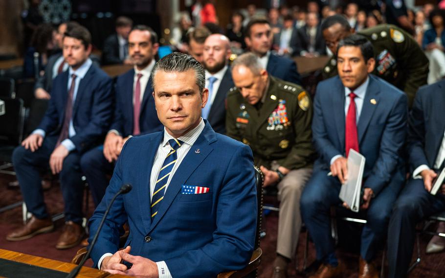 Justin Fulcher, far left, is seen at a Senate Armed Services Committee hearing on June 18 with Hegseth and other senior Pentagon officials. 