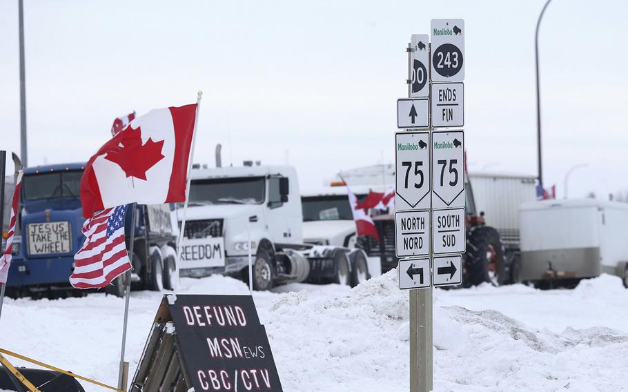 Trucks blockade the U.S.-Canada border crossing during a demonstration in Emerson, Manitoba, Canada, on Feb. 13, 2022. 