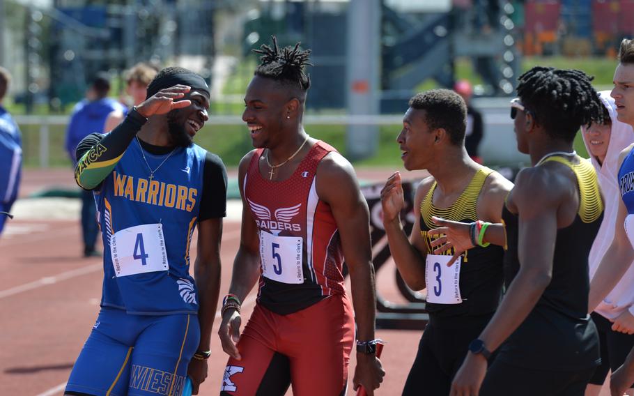 Track runners from different DODEA schools exchange congratulations and handshakes after a run event during the Kaiserslautern Track and Field Invitational  on Saturday,April 16, 2022, in Kaiserslautern, Germany. After two years of cancelled or virtual events, track and field athletes competed in person for the season starter this year. 