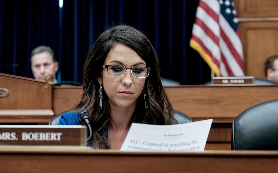 Rep. Rep. Lauren Boebert, R-Colo., reads at a hearing on Capitol Hill earlier this year.