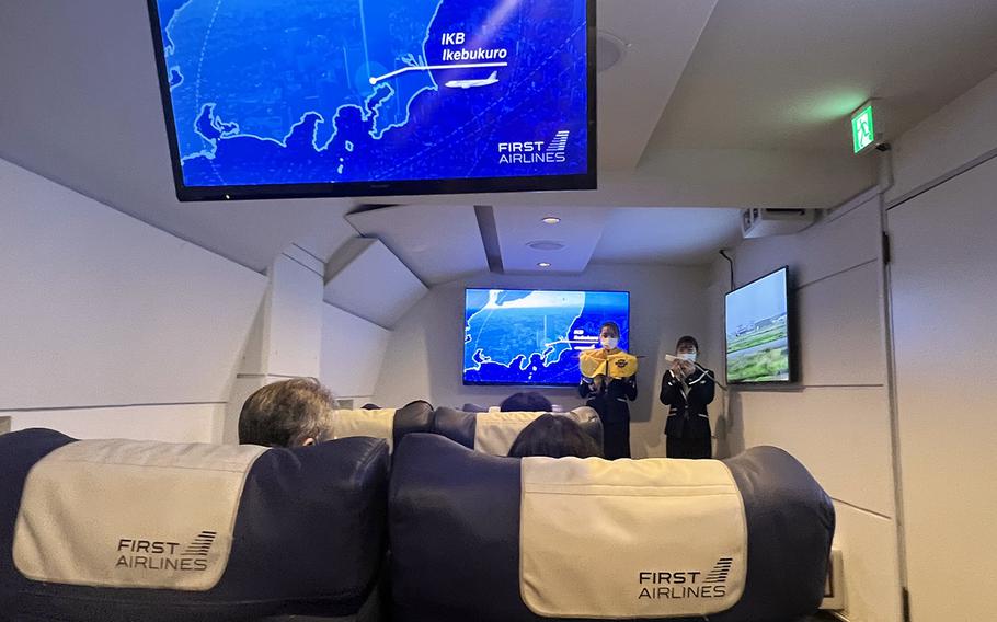 Flight attendants perform a safety brief at the First Airlines restaurant in Tokyo’s Ikebukuro district, March 3, 2024. 