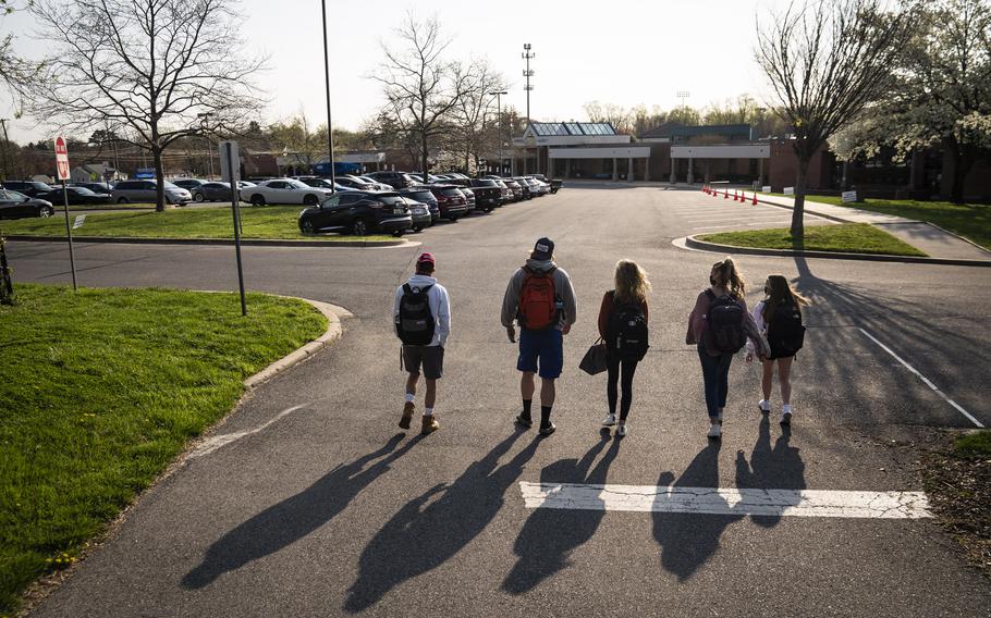 Senior students catch up as they return to in-person school for the first time this year at Sherwood High School in Maryland in April 2021. 