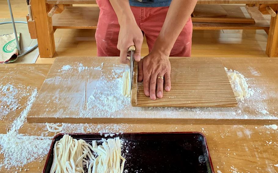 Slicing udon noodles in the kitchen at Komatsuzawa Leisure Farm in Saitama prefecture, Japan, July 24, 2022.